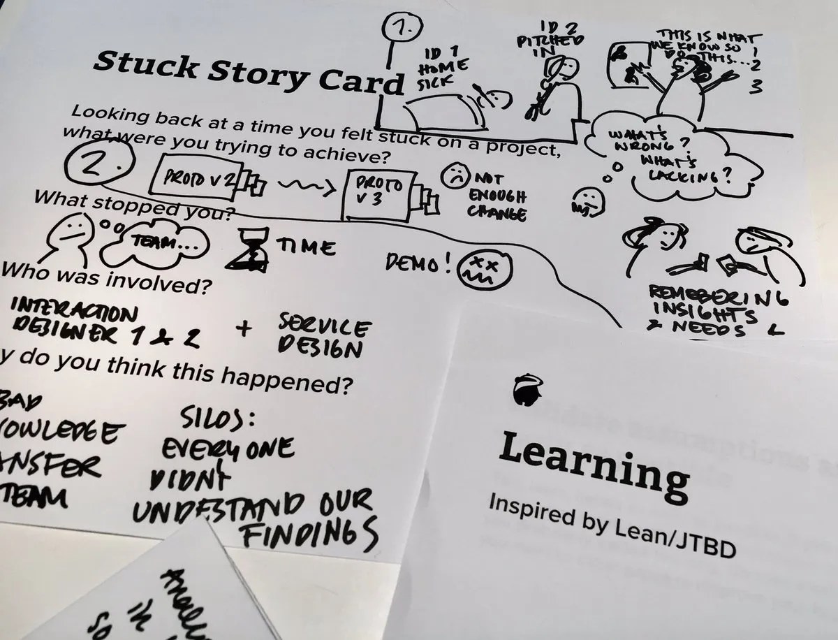 A hand-annotated &lsquo;Stuck Story Card&rsquo; worksheet from the Unstick playcards, next to a &lsquo;Learning&rsquo; card inspired by Lean/JTBD.