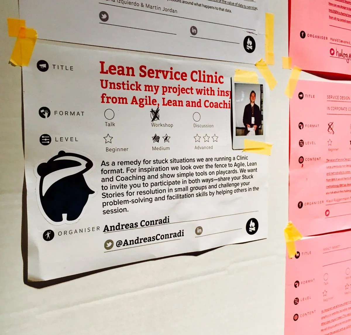 Session poster on a wall: &lsquo;Lean Service Clinic &mdash; Unstick my project with inspiration from Agile, Lean and Coaching&rsquo;, organised by Andreas Conradi.